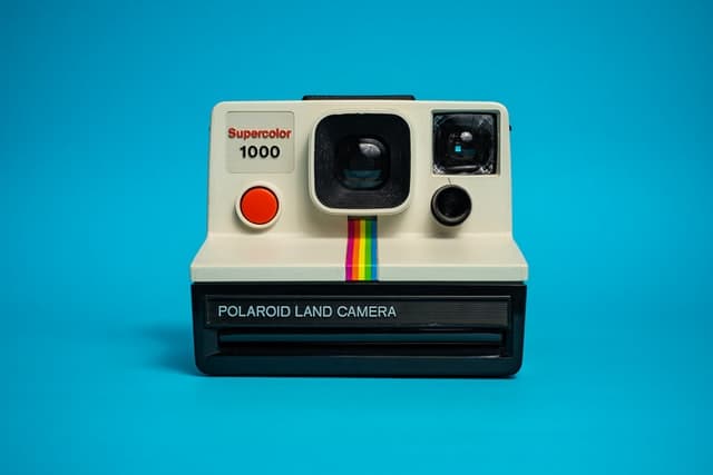 Polaroid camera on a light blue background